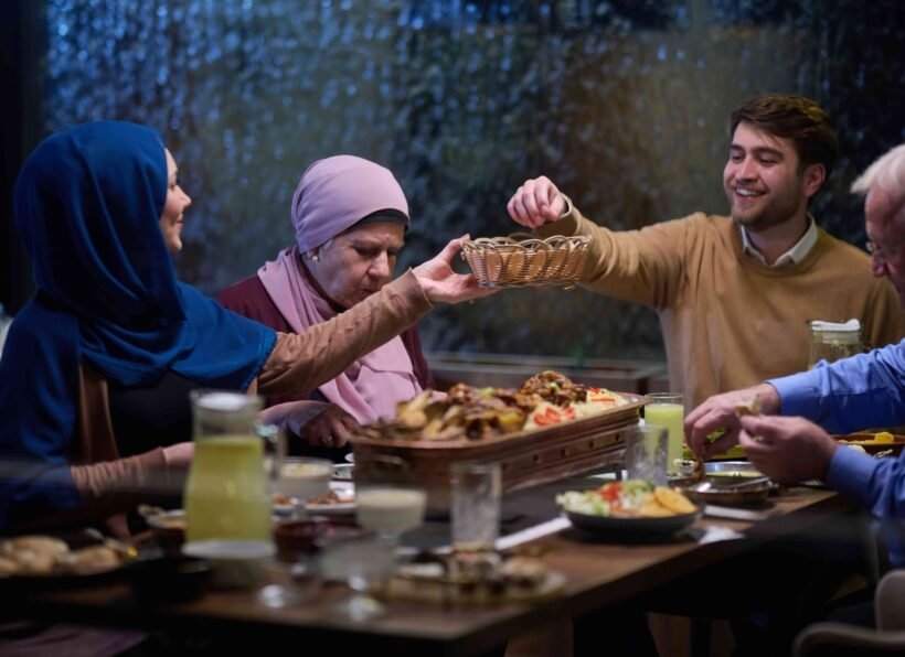 A modern and traditional European Islamic family comes together for iftar in a contemporary restaurant during the Ramadan fasting period, embodying cultural harmony and familial unity amidst a culinary celebration of diversity A modern and traditional European Islamic family comes together for iftar in a contemporary restaurant during the Ramadan fasting period, embodying cultural harmony and familial unity amidst a culinary celebration of diversity.